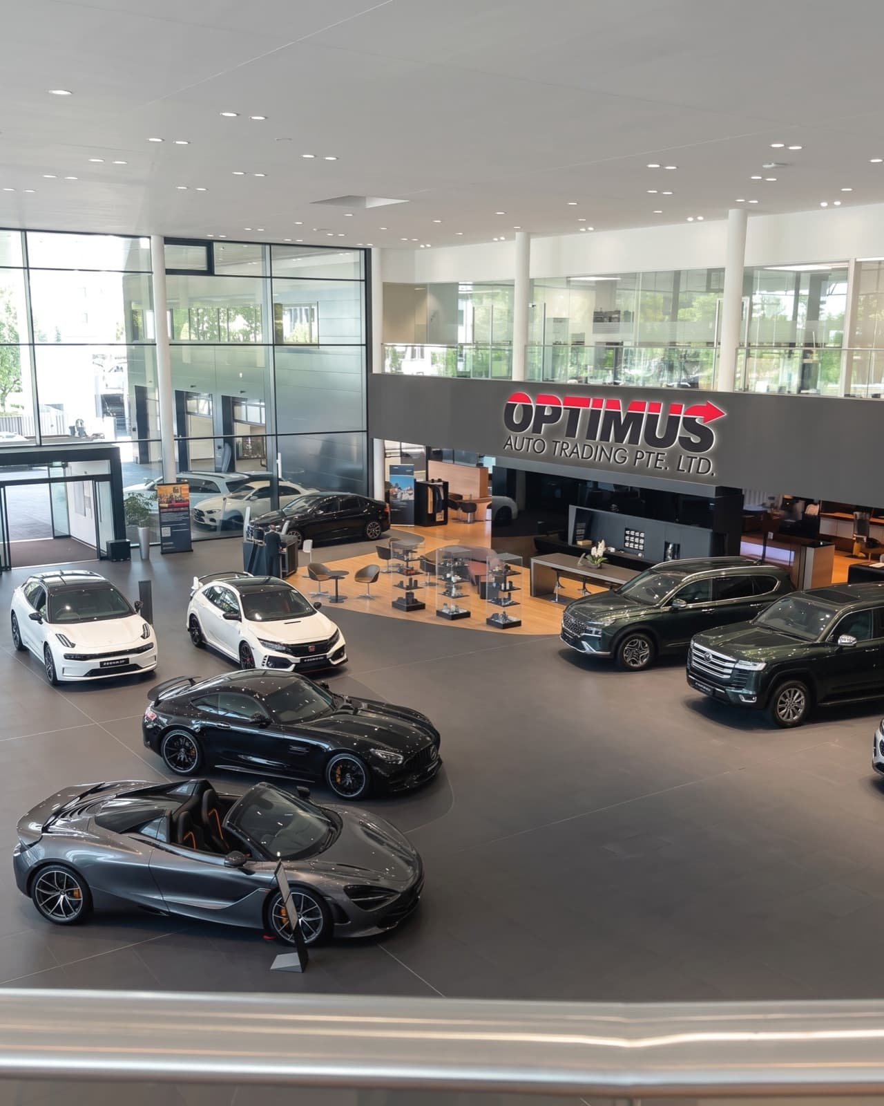 Vehicles on display inside the Optimus Auto Trading showroom in Singapore